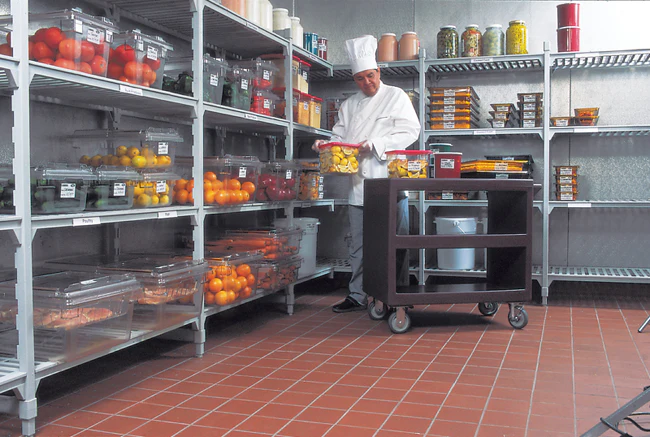 Loading Food Into A Walk In Freezer